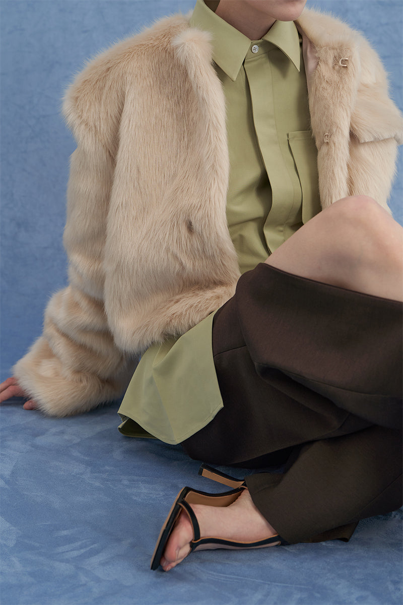 Beige JINSUN exaggerated shoulder shearling jacket with plush collar and stylish design, shown on a model.