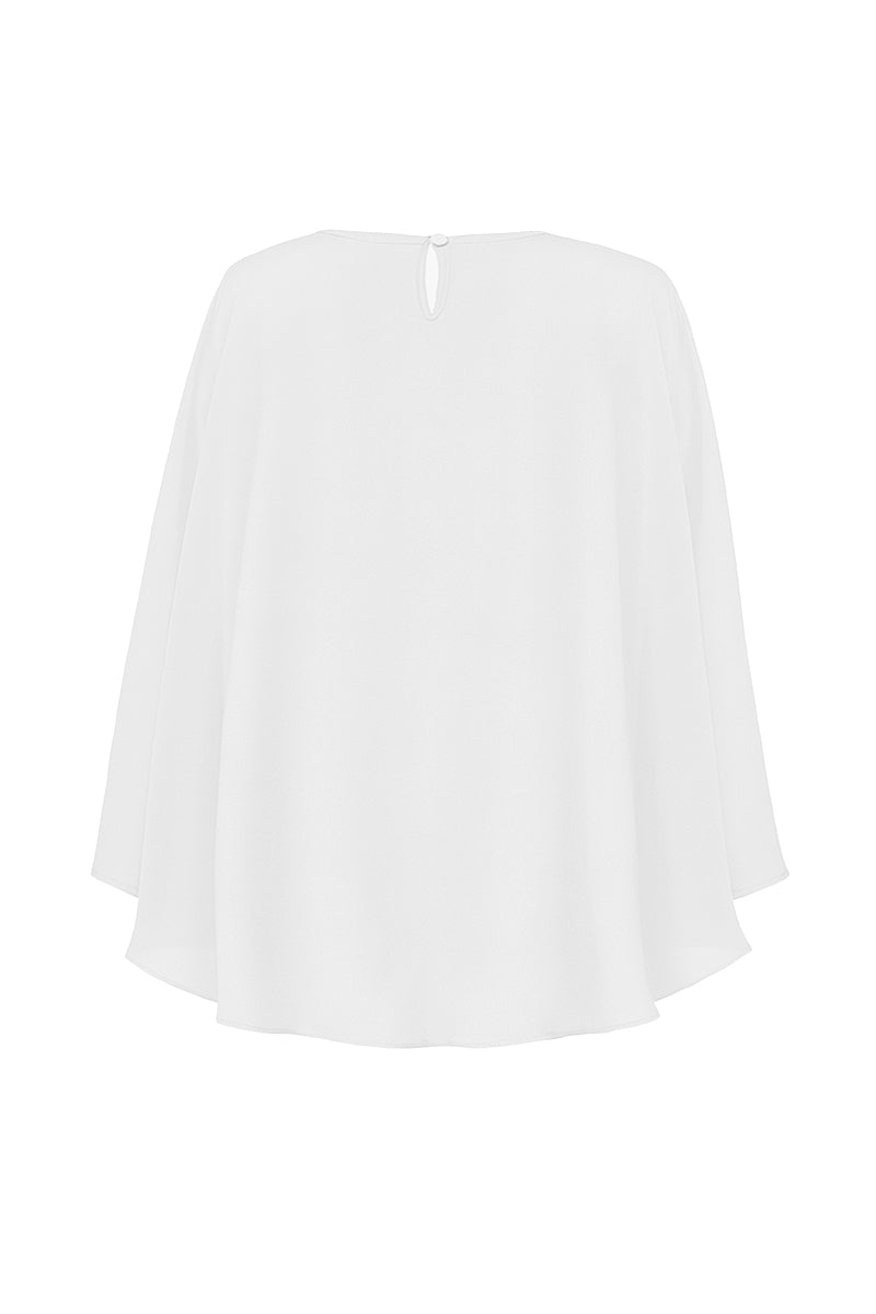 White chiffon Viona cape jacket by Nazlı Ceren featuring elegant, flowing fabric and a stylish, draped design for sophisticated wear.