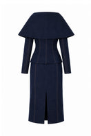 Lili Blanc LINEA denim midi skirt with classic blue wash, high waist, and side pockets, styled with a casual top.