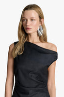 Elegant Acaria Studio Anna midi dress displayed on a hanger with floral pattern and flowing fabric.