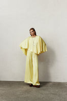Nazlı Ceren MUI wide leg satin trousers in Lemon Zest, showcasing vibrant yellow, high-waisted design, and flowing fabric.