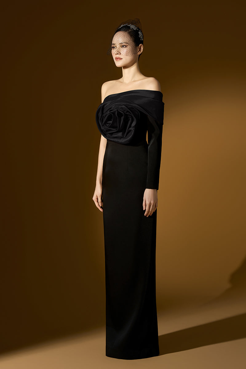 Black crepe and taffeta gown by I.H.F, featuring a flowing silhouette and elegant design, perfect for formal occasions.