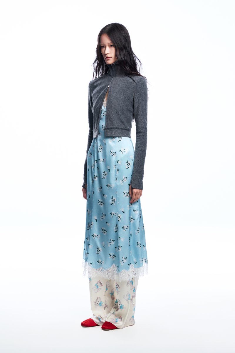 Chictopia floral slip midi dress with a fitted bodice and flowing skirt, featuring a vibrant floral pattern and spaghetti straps.