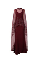 Raishma Aurelia Gown featuring elegant fabric and intricate design, displayed on a hanger with a neutral background.