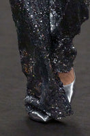 Lili Blanc sequin high-waist trousers showcasing shiny sequined fabric and tailored fit, stylish for evening wear or parties.