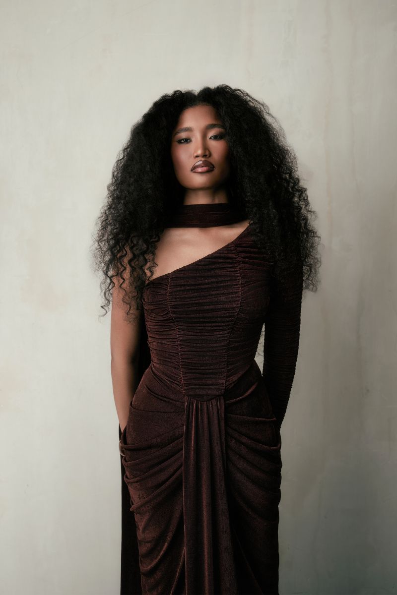 KEMMIYE brown maxi dress by Khanum's, flowing fabric, long sleeves, and elegant design, shown on a model.