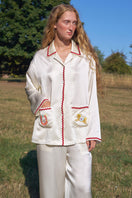 Women’s silk pajama set by Not Just Pajama featuring a Lucky Pony design, with long sleeves and relaxed fit.