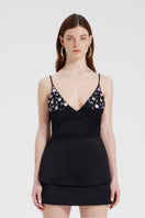 Black embroidered V-neck top by Nara Niro featuring intricate embroidery and a flattering V-neck design.