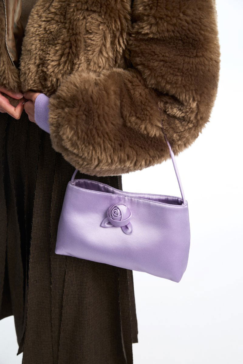 Chictopia silk top handle bag in lilac with sleek design and elegant handles, perfect for stylish accessories.