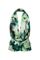Green floral halter top by Suncillo, featuring a vibrant pattern and adjustable straps, displayed on a mannequin.