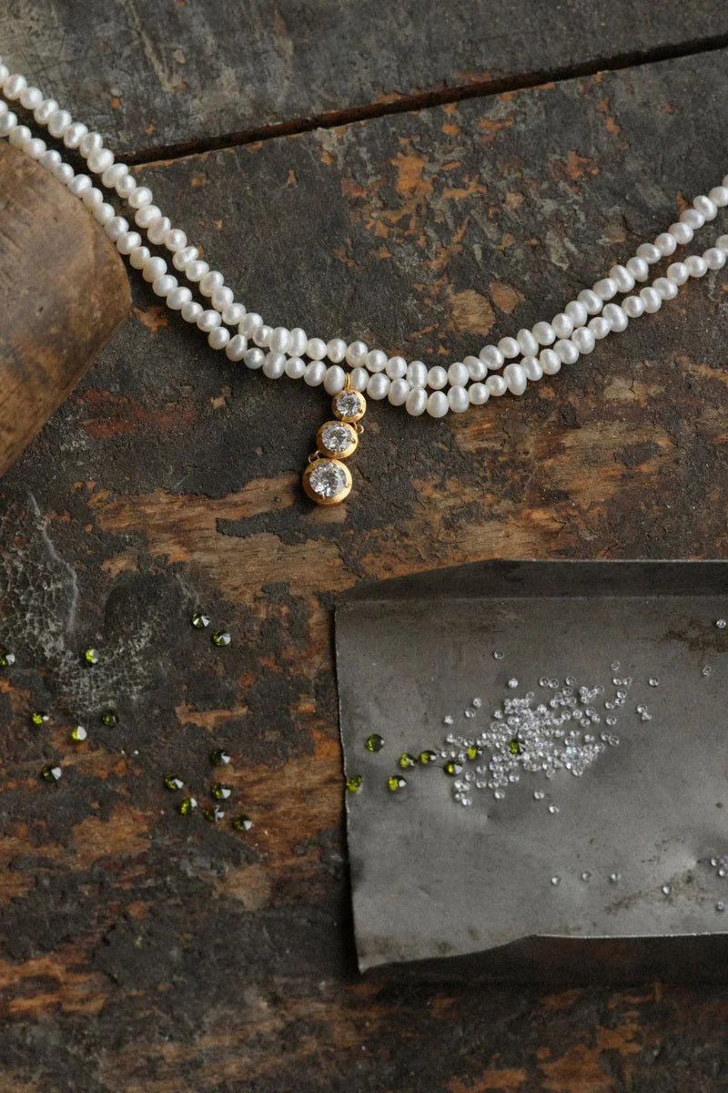 Peracas Bella Choker necklace with a sleek, modern design, featuring a black cord and silver-toned pendant.