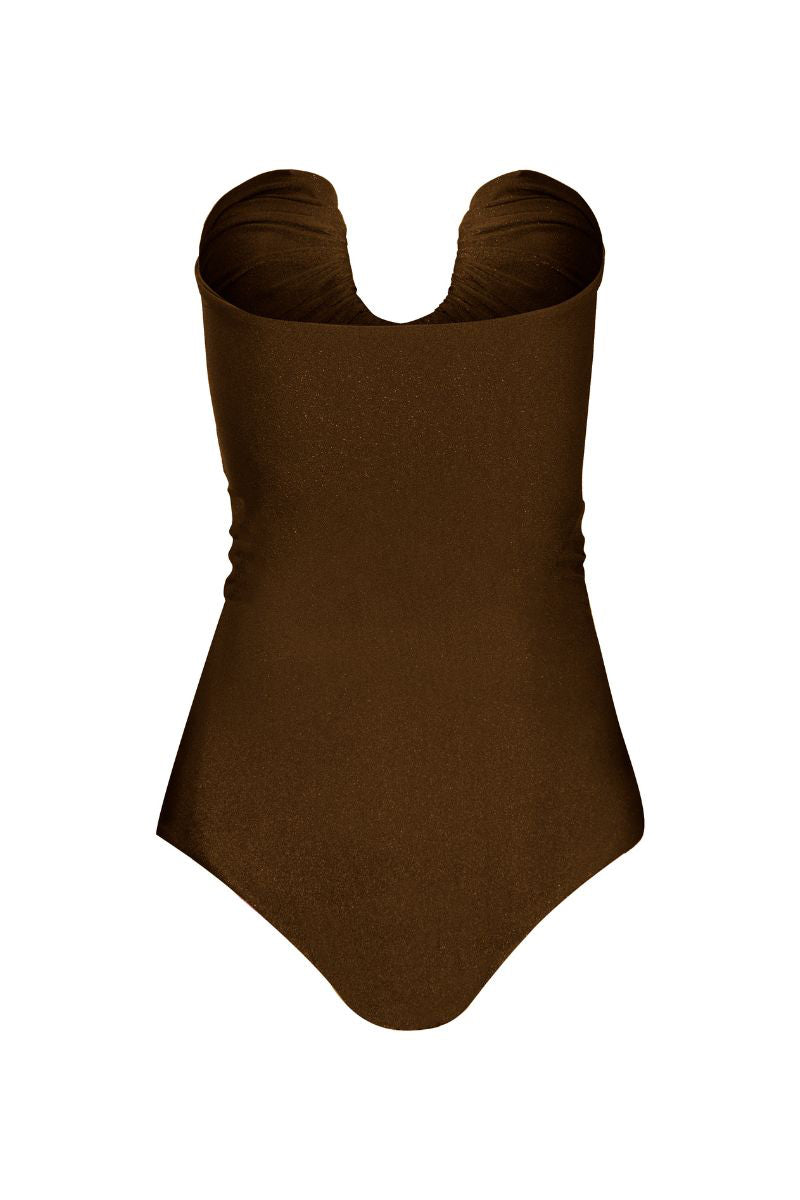 Laura Escobar Serrania brown one-piece swimsuit with a sleek design, shown on a model in a pool setting.