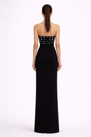 Nihan Peker Sabaa black gown with elegant flowing fabric and intricate detailing, perfect for formal occasions.