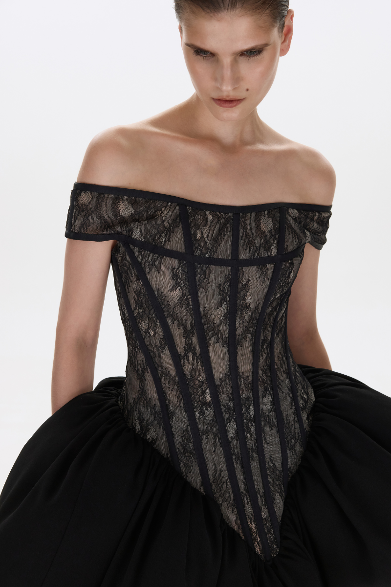 Black THEA mini dress by BALYKINA, showcasing a stylish short dress with a fitted silhouette and elegant design.