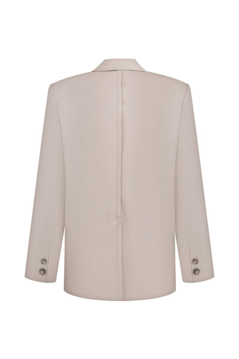 Elenareva taupe wool tailored jacket displayed on a hanger, showing its sleek design and classic fit.