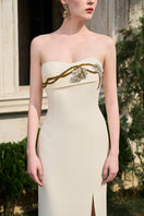 Elegant Tracy Studio matte weave gown with a flowing silhouette and textured fabric, perfect for formal occasions.