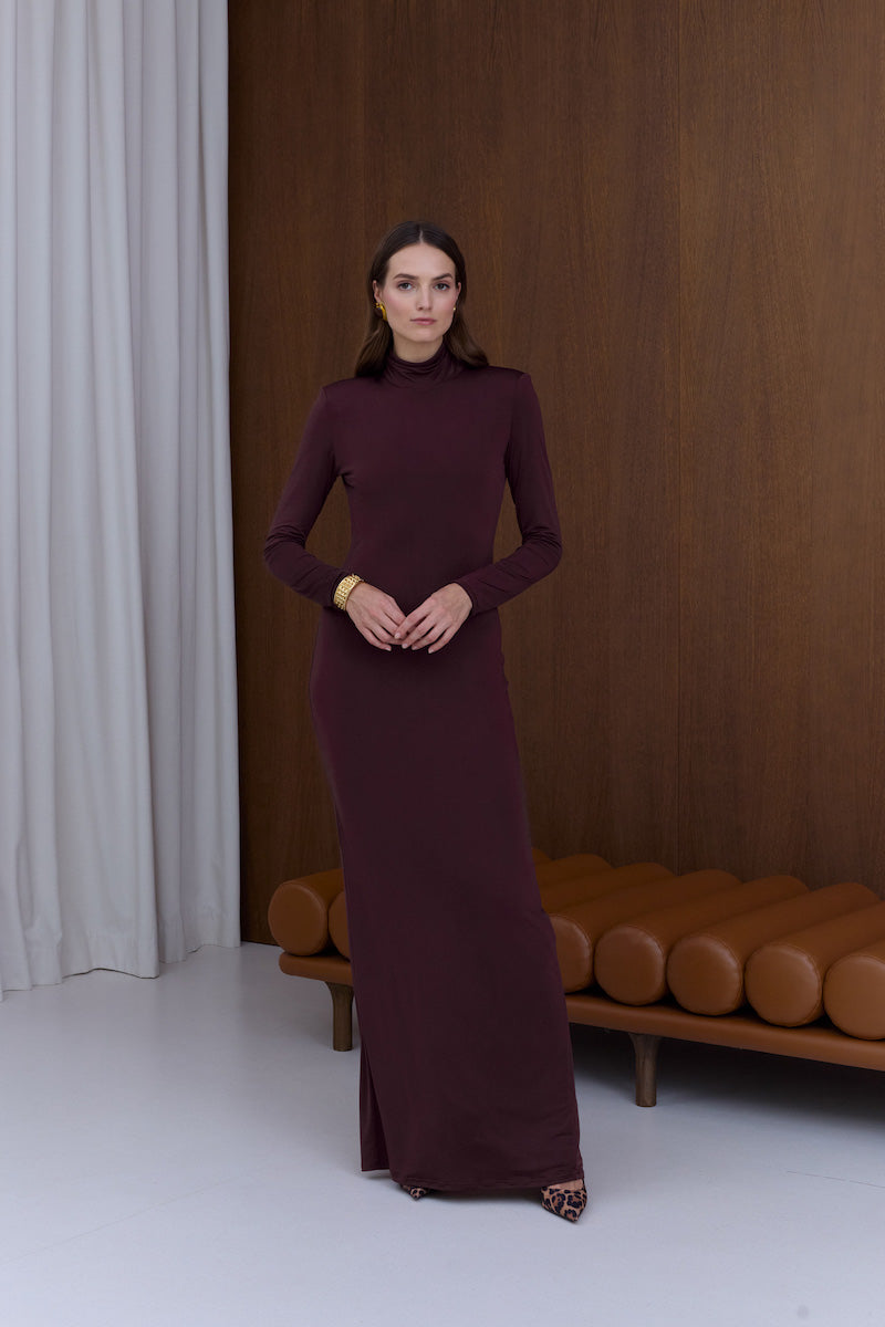 Undress Cintia open-back maxi dress in burgundy, flowing fabric with a deep V neckline and open back design.