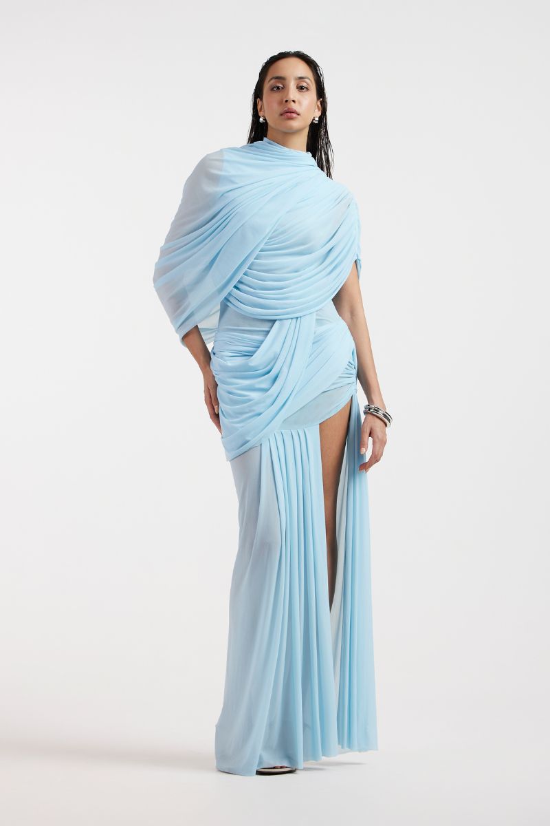 Deme By Gabriella Jovana draped blue maxi dress featuring flowing fabric and elegant design, perfect for formal occasions.