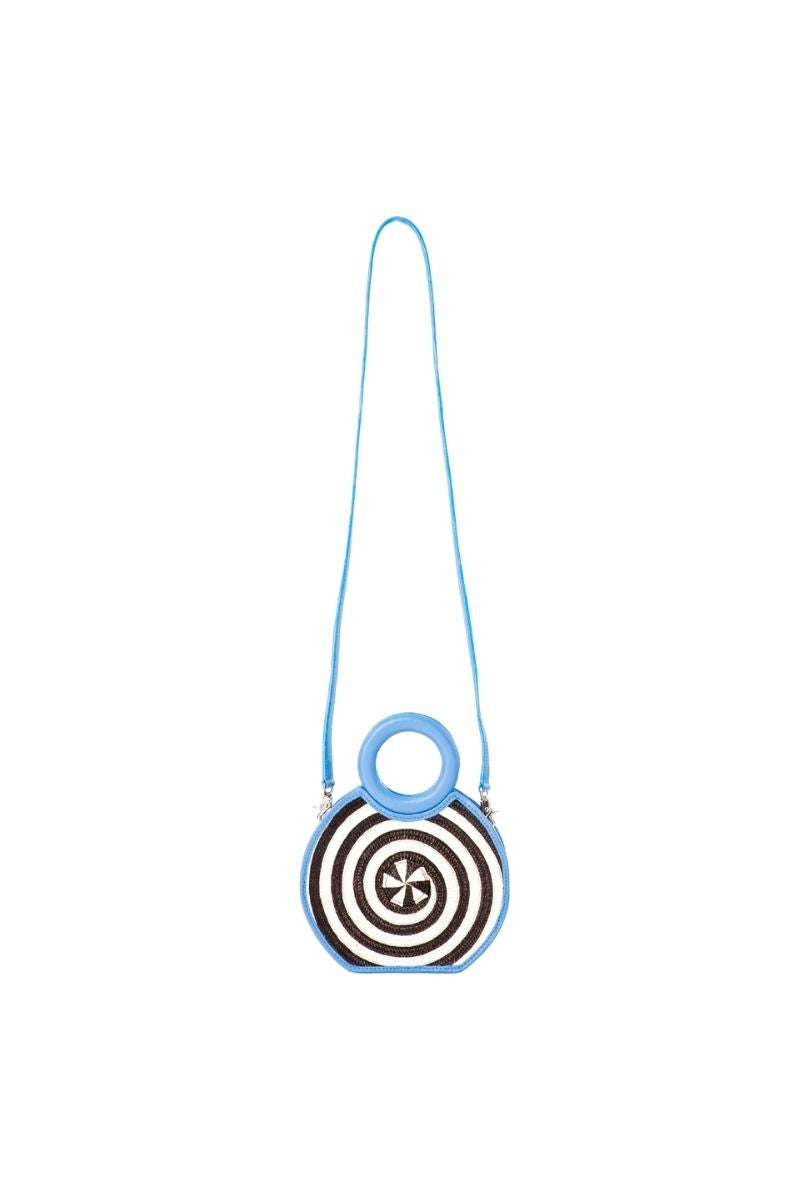Adriana Castro Zenú mini raffia and leather top handle bag in baby blue with woven raffia details and leather accents.