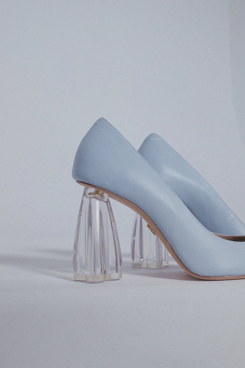Blue Fiorellini glass pump heels by House of Atana, featuring transparent heel design and elegant styling.