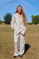Unisex brown print twill pajama set from Not Just Pajama featuring long sleeves and matching pants.