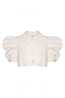 Liya white cloud crop top with short sleeves and a relaxed fit, displayed on a hanger.