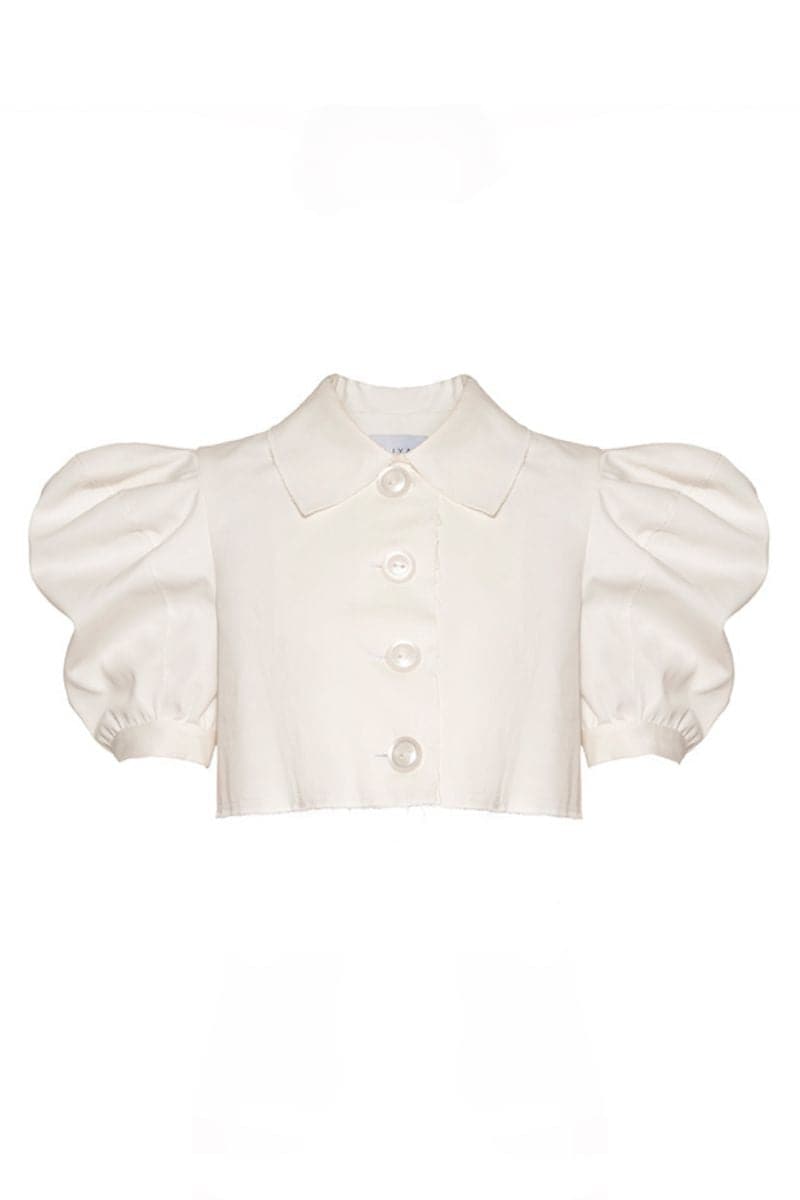 Liya white cloud crop top with short sleeves and a relaxed fit, displayed on a hanger.