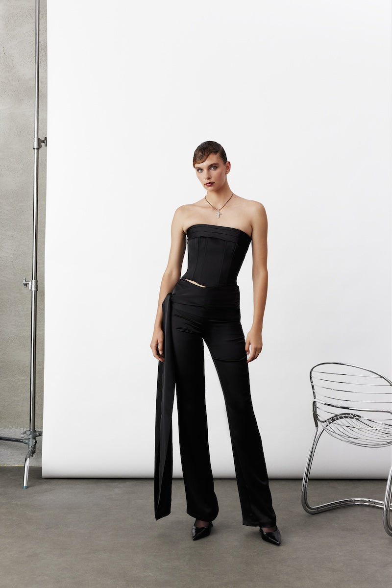 Black satin trousers from Nazlı Ceren featuring a high-waisted, tailored fit with sleek, smooth fabric.
