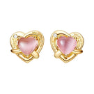 Nana Jacqueline Ambre pink and gold heart earrings featuring delicate heart-shaped design with pink and gold accents.
