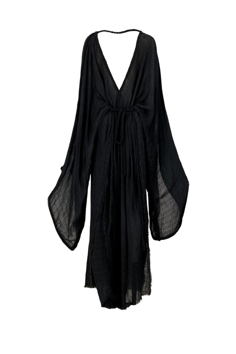 Kasia Kulenty Helia kaftan maxi dress in midnight with flowing fabric and elegant design, worn by a model outdoors.
