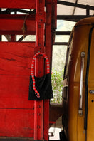 Black Serpent Big shoulder bag with red and white accents from SAC DE SOUL, showcasing textured leather and stylish design.