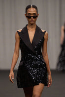 Lili Blanc sleeveless sequin mini dress with a fitted silhouette and shimmering embellishments, perfect for evening wear.