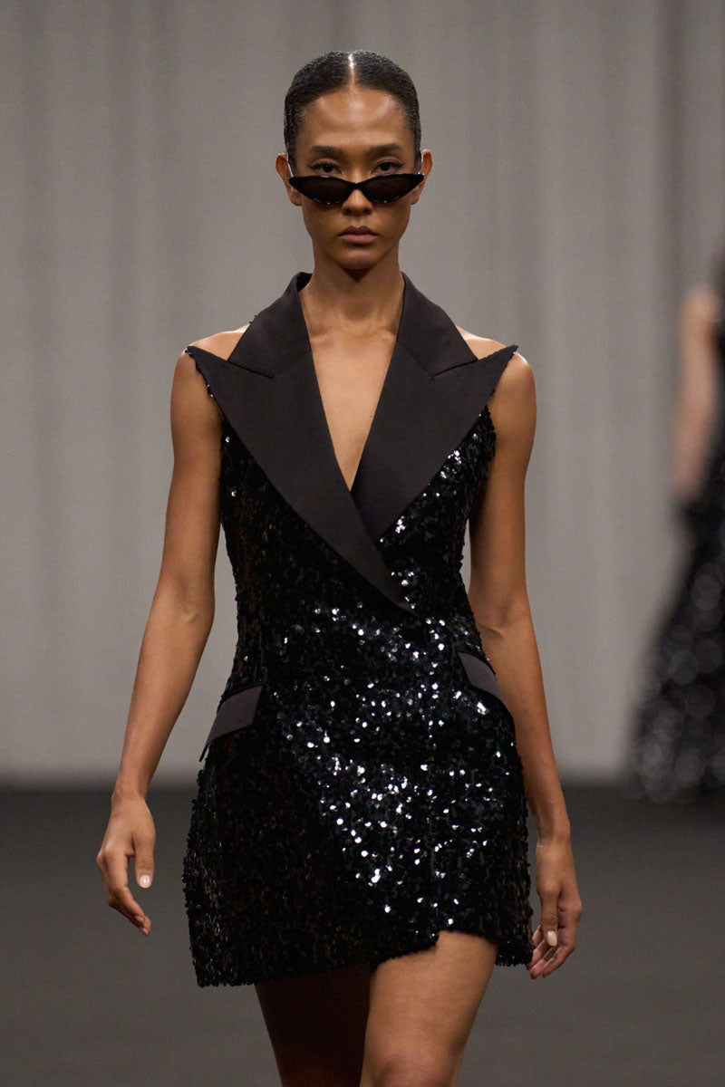Lili Blanc sleeveless sequin mini dress with a fitted silhouette and shimmering embellishments, perfect for evening wear.