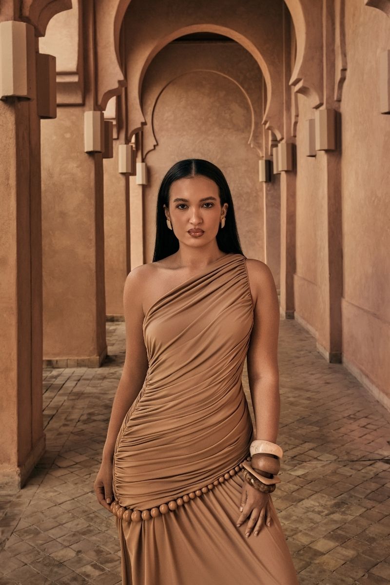 Khanum's tan KASBA maxi dress with flowing fabric and elegant design, ideal for casual or formal occasions.