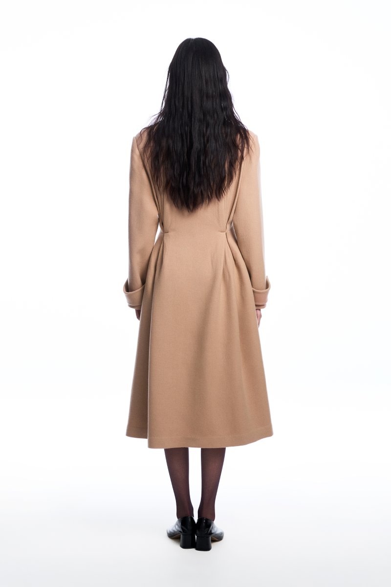 Beige wool coat with pleats from Chictopia, featuring a tailored fit and classic design, shown hanging on a rack.