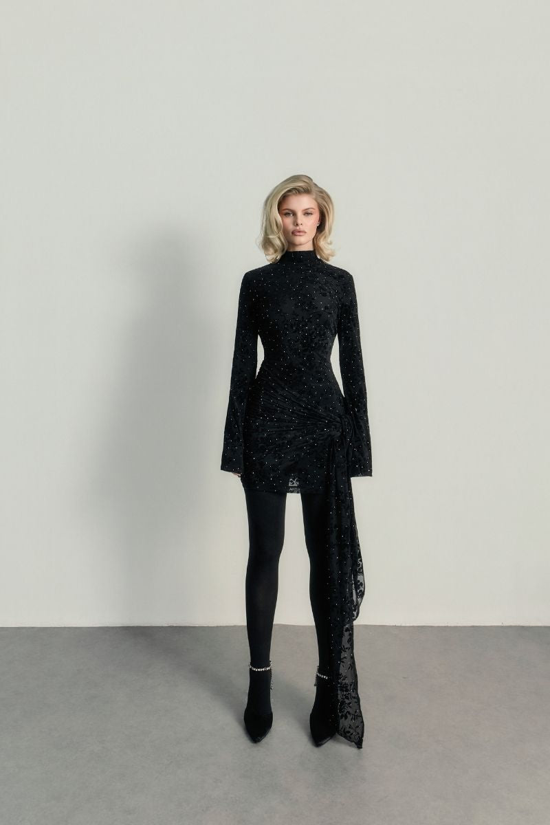 Black Kalesy mini dress by Khanum's, featuring a fitted silhouette and stylish design, shown on a model.