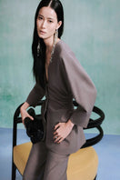 Gray Leicia long sleeve shirt with a fitted design, shown on a model, featuring a round neckline and soft fabric.
