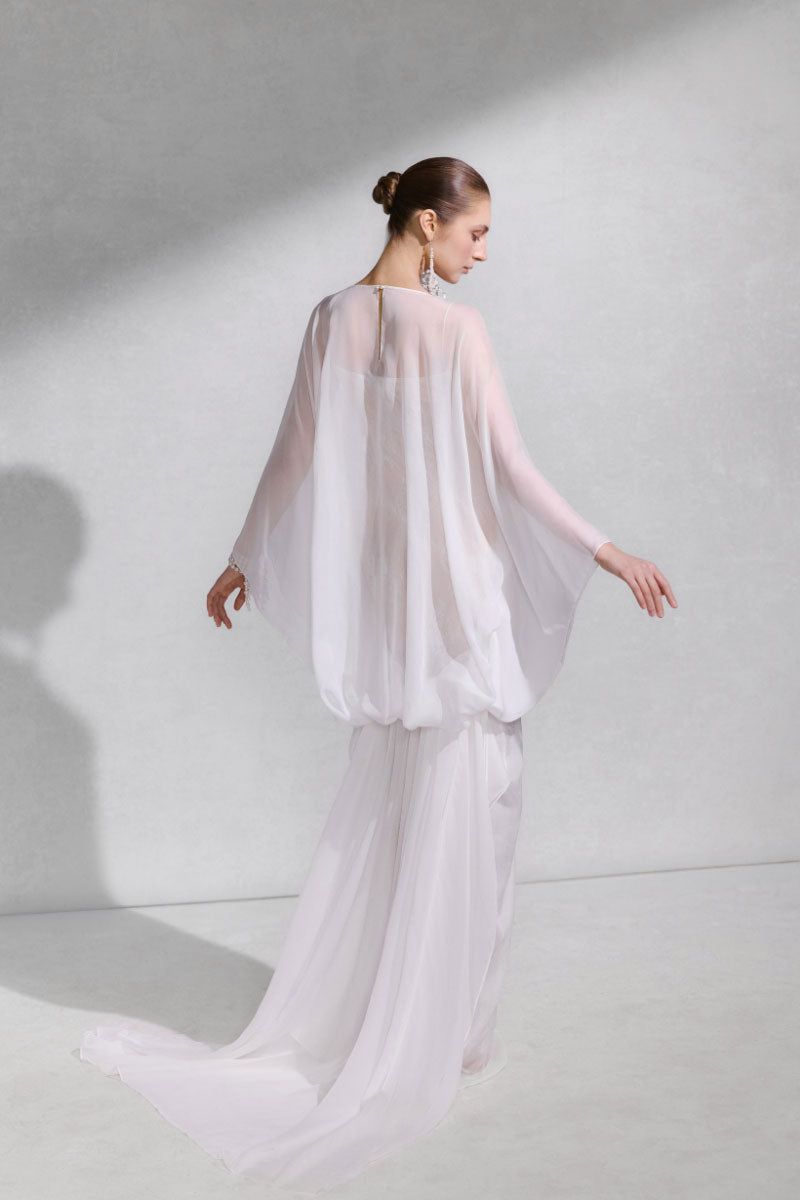 Elegant Arti Apparel GENUS maxi dress with a flowing silhouette and stylish design, perfect for casual or formal occasions.