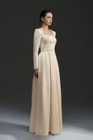 Gold silk taffeta gown by I.H.F Studio, featuring a flowing design and elegant silhouette.