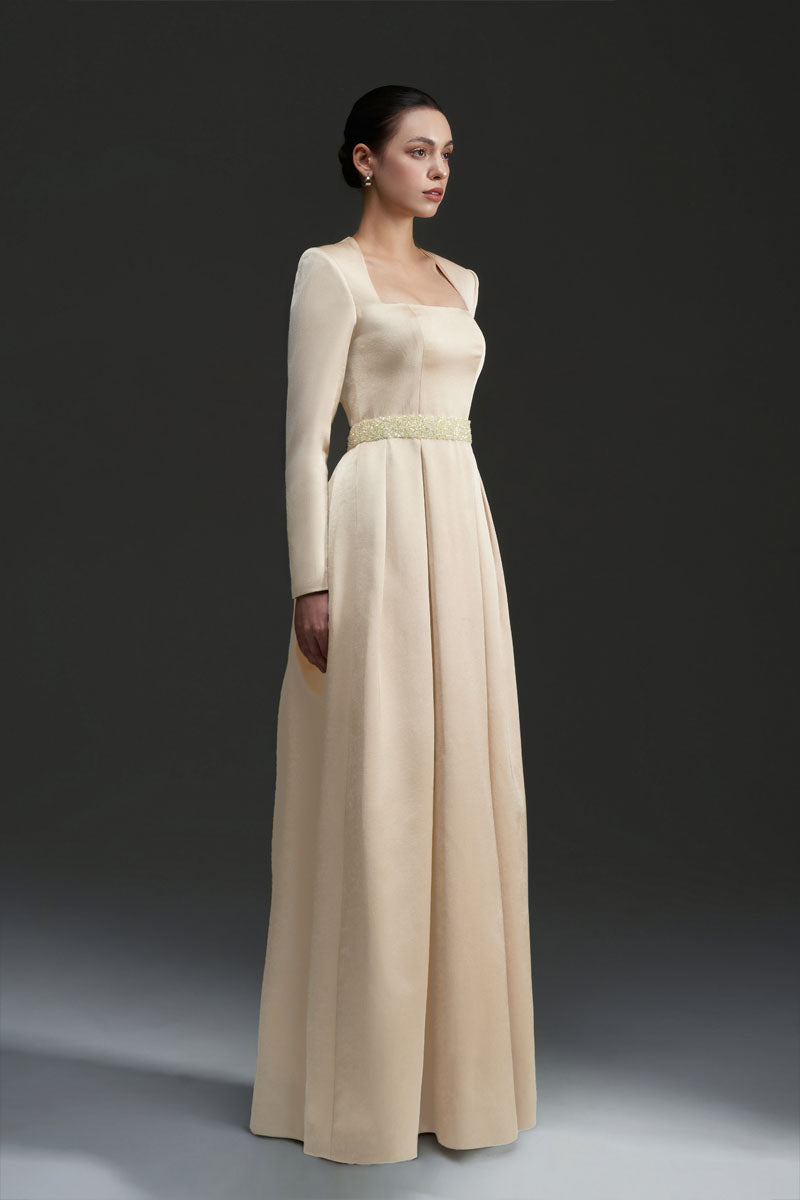 Gold silk taffeta gown by I.H.F Studio, featuring a flowing design and elegant silhouette.