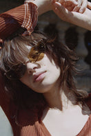 Moy Atelier Poisoned Apples Forget Me Not sunglasses with colorful, whimsical apple-themed frames and tinted lenses.