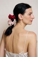 Two Tuscan Rose silk scrunchies from Not Just Pajama, featuring soft, luxurious silk fabric perfect for hair accessories.
