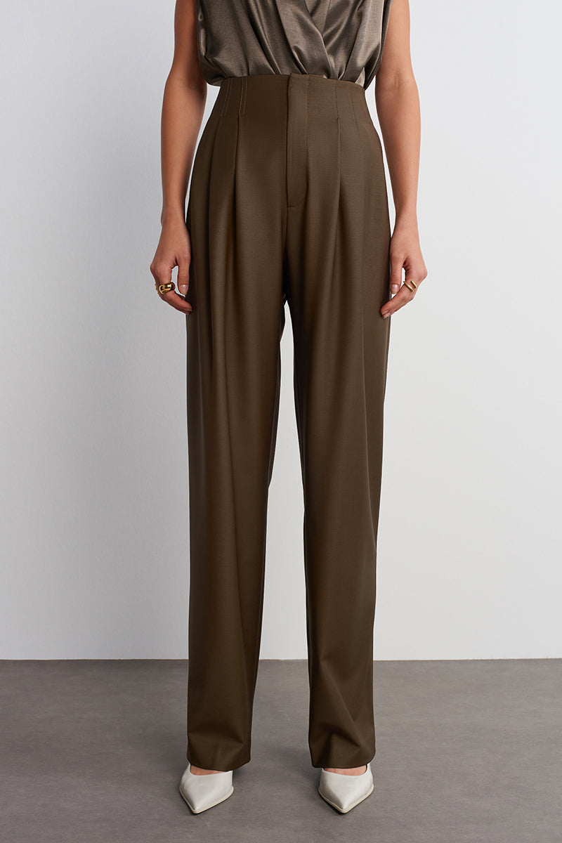 Dark brown Earth pants by Acaria Studio, showing a close-up of the stylish, comfortable pants fabric and fit.