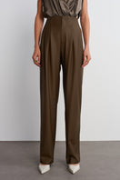 Dark brown Earth pants by Acaria Studio, showing a close-up of the stylish, comfortable pants fabric and fit.