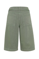TT Studios PAM shorts in green with a relaxed fit, displayed on a hanger with a clean background.