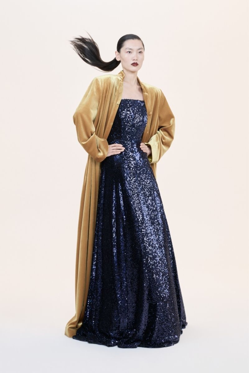 Nihan Peker Vertigo strapless gown in elegant fabric, featuring a fitted bodice and flowing skirt suitable for formal occasions.