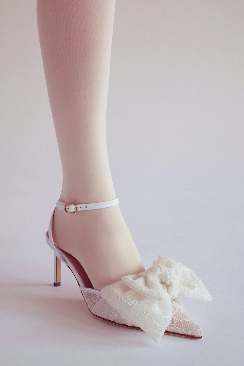 White lace Bow Slipper heels by House of Atana, featuring elegant lace details and a stylish slip-on design.