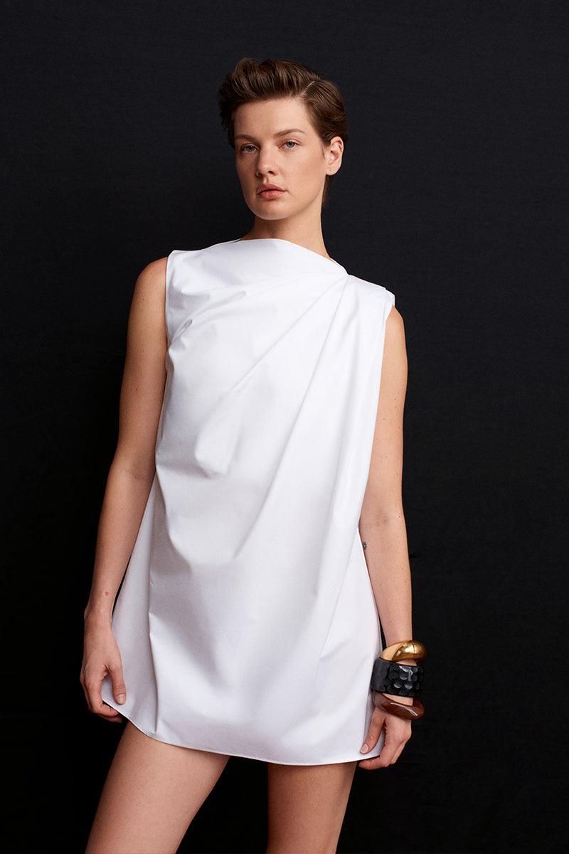 Acaria Studio Roma Mini Dress displayed on a hanger, featuring a stylish short dress with a fitted silhouette and elegant design.