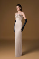 Beige crepe silk lined gown by I.H.F, featuring elegant fabric and flowing silhouette, shown on a hanger.