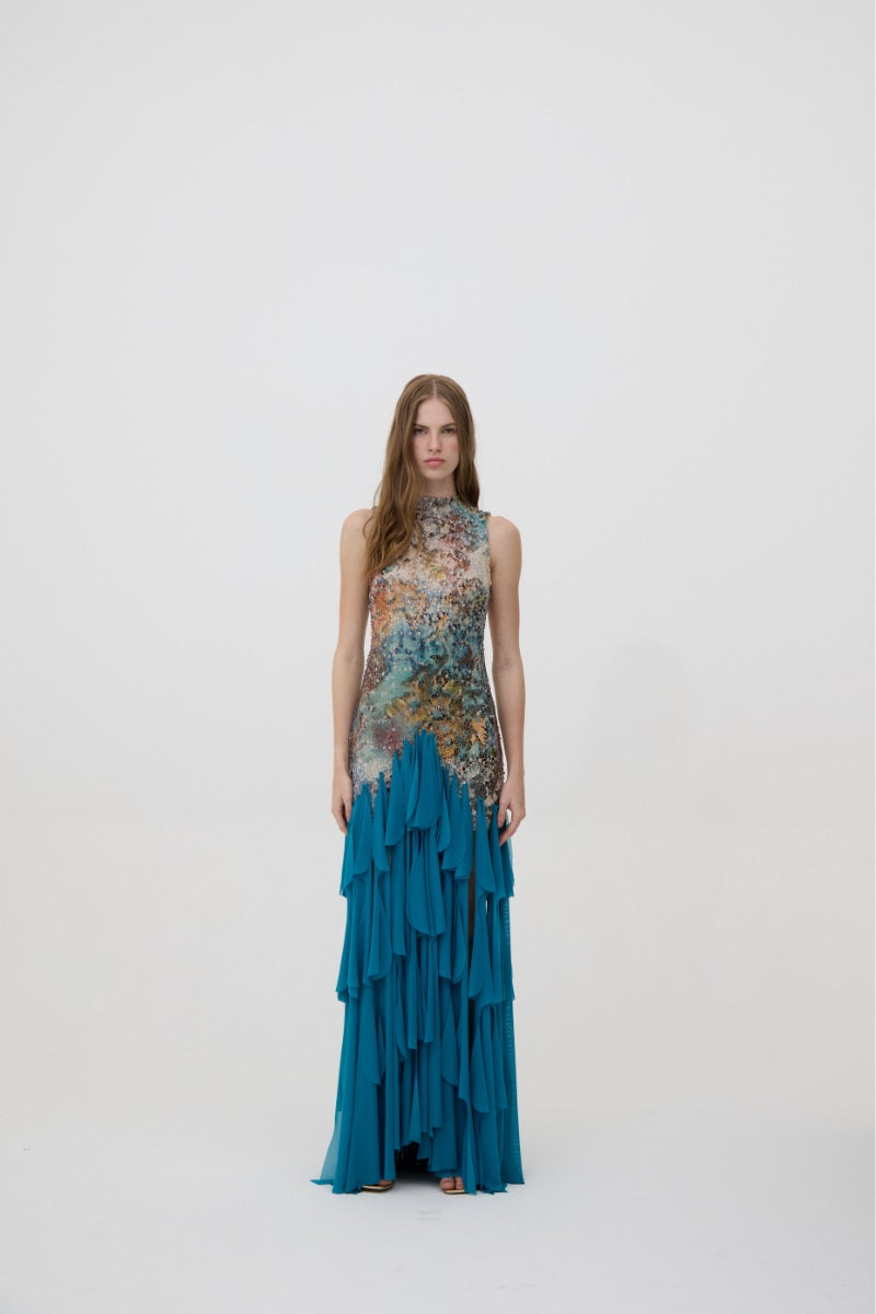 Kontenta Marina Party Dress in Netuno Blue, a stylish maxi dress with flowing fabric and elegant design for special occasions.